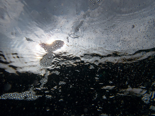 Underwater Bubbles Against Vibrant Ocean Backdrops