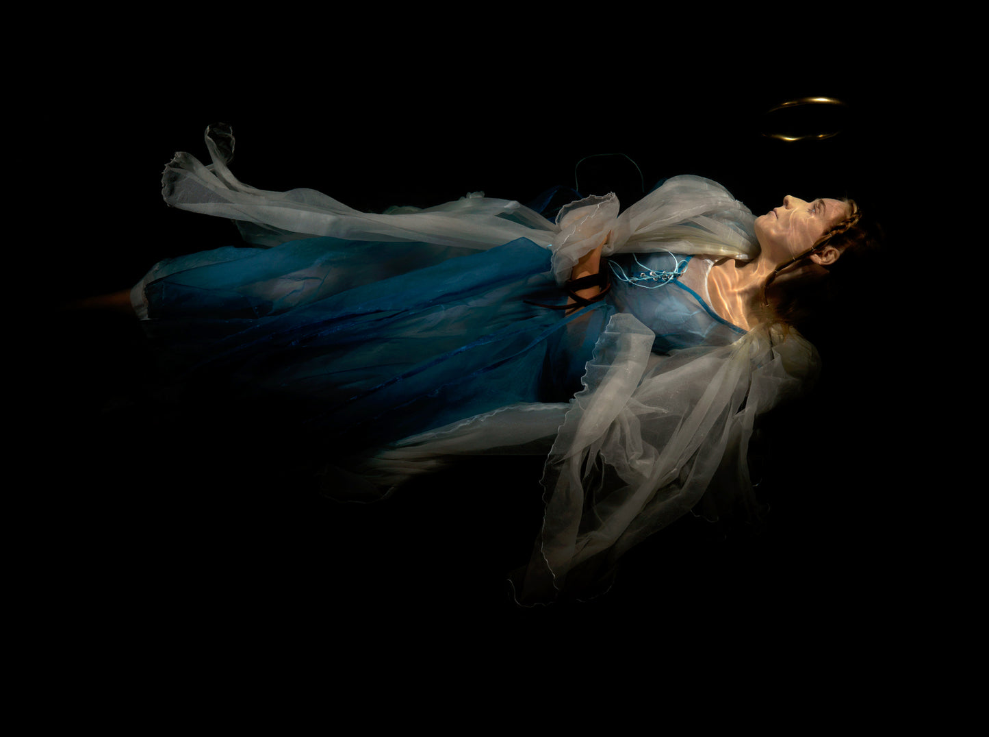 Unique archival pigment print featuring a flowing blue and white dress against a dark background.