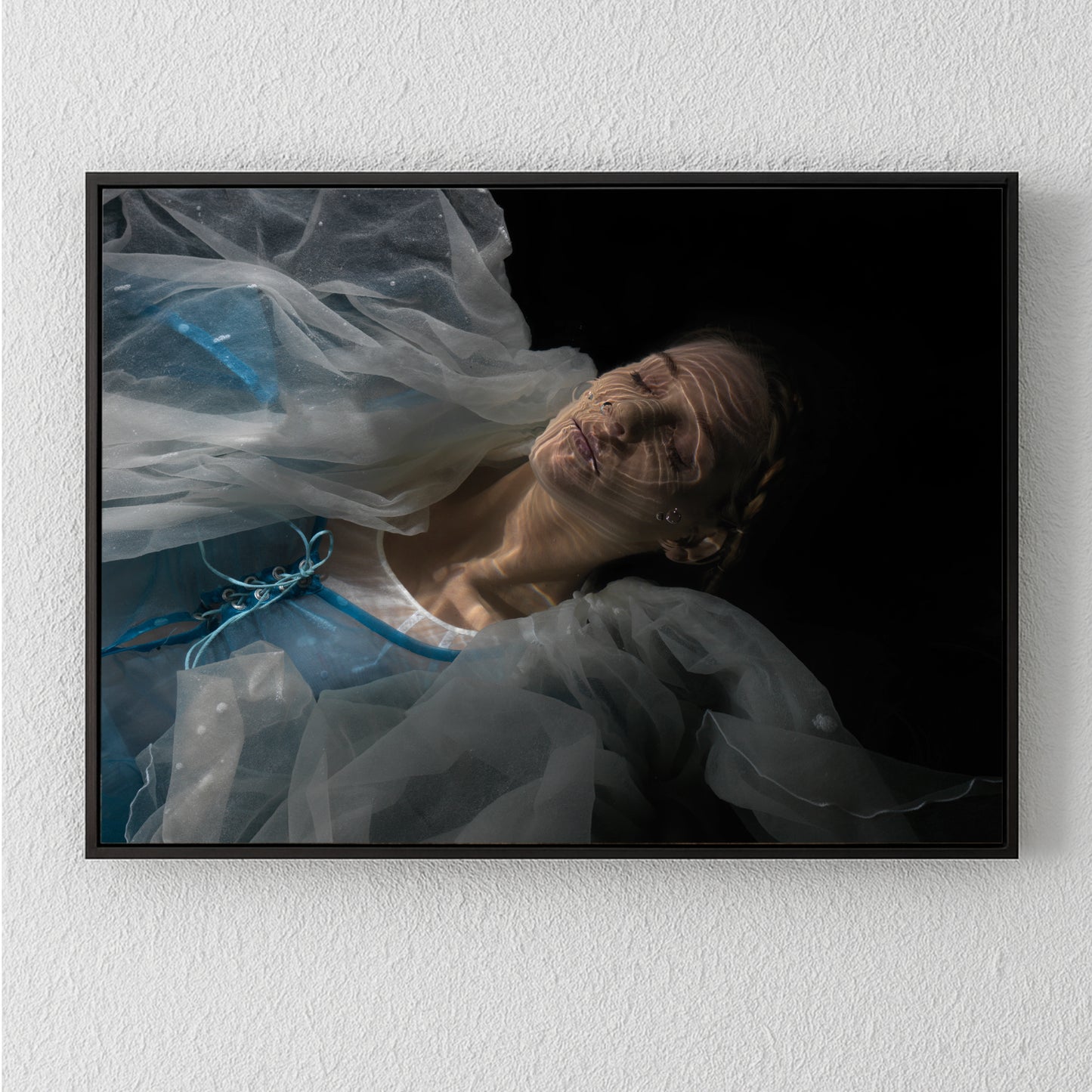 Unique archival pigment print featuring a serene woman in translucent fabric against a dark background.