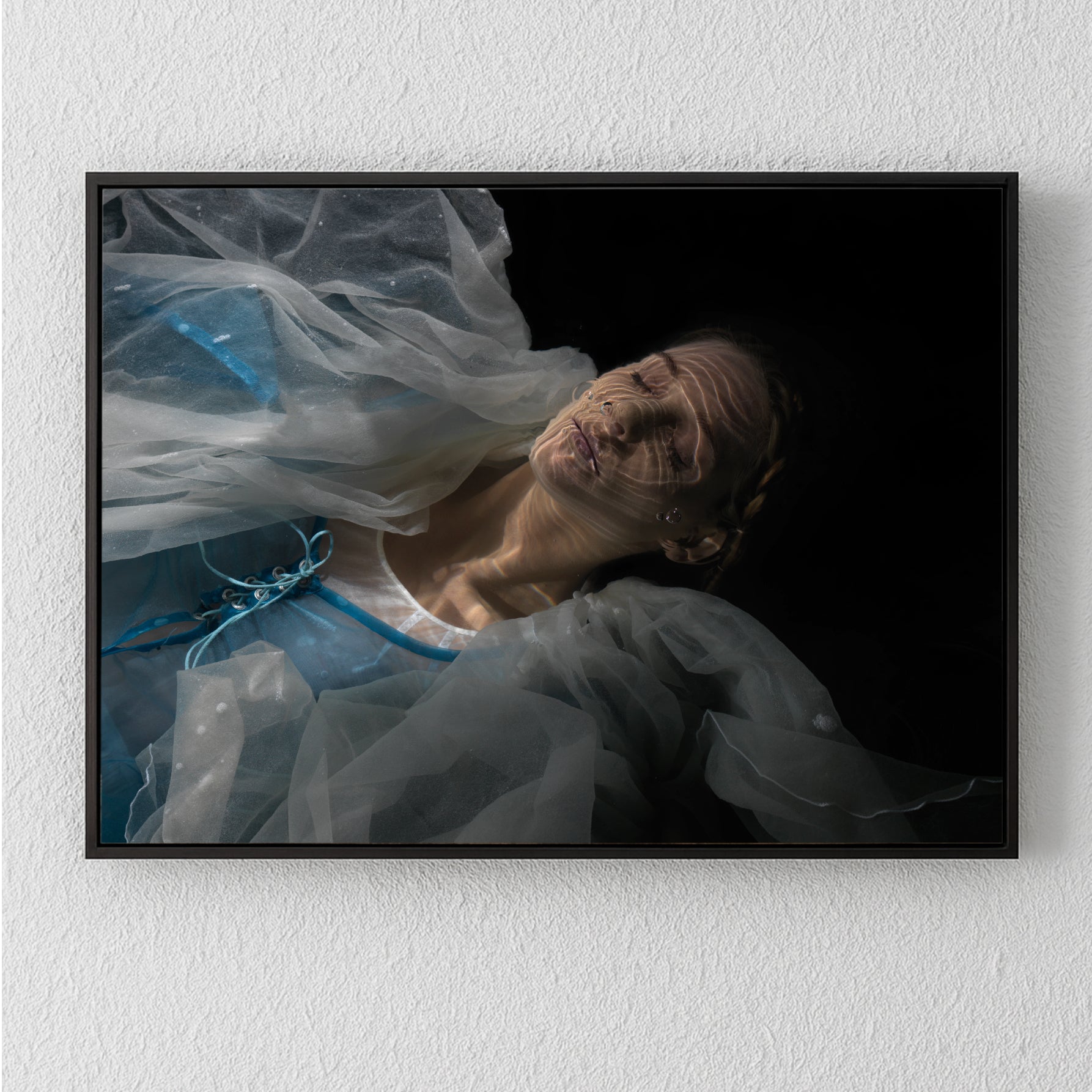 Unique archival pigment print featuring a serene woman in translucent fabric against a dark background.