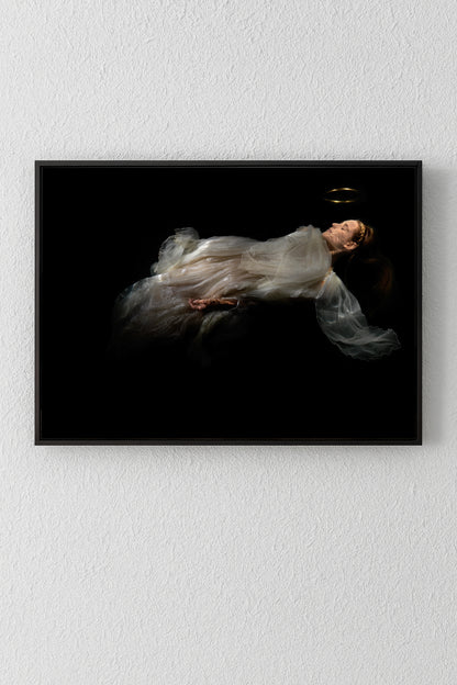 Unique archival pigment print of a floating woman in a translucent gown on black background.