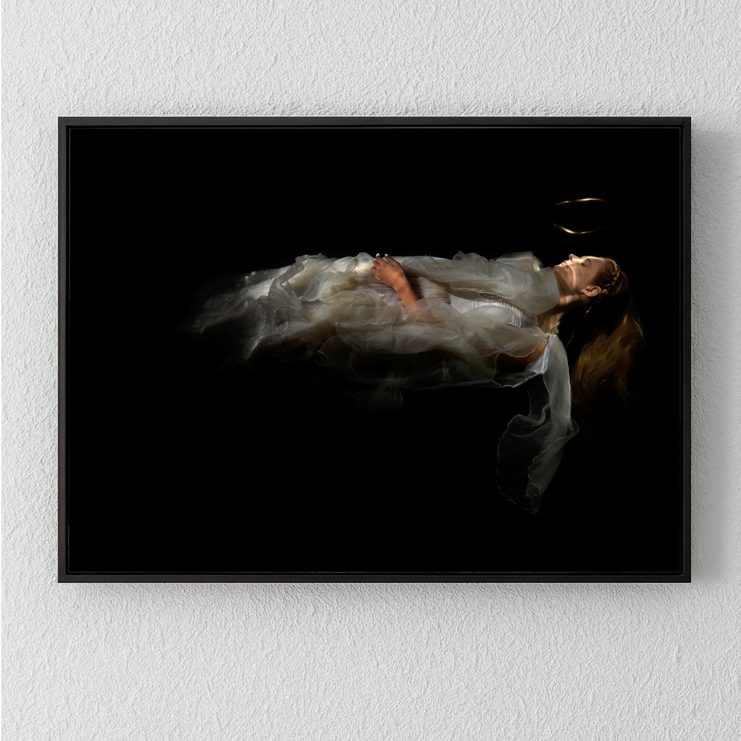 Unique archival pigment print featuring a softly lit figure in flowing white fabric on black background.