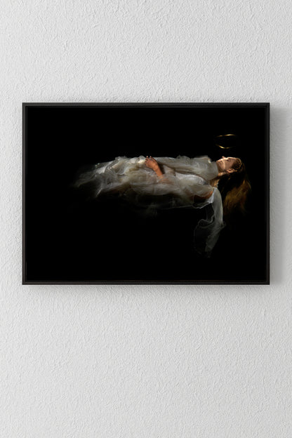Unique archival pigment print of a woman in flowing dress suspended against a black background.