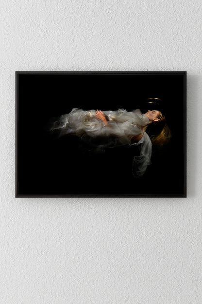 Unique archival pigment print of a woman in flowing white dress against black background.