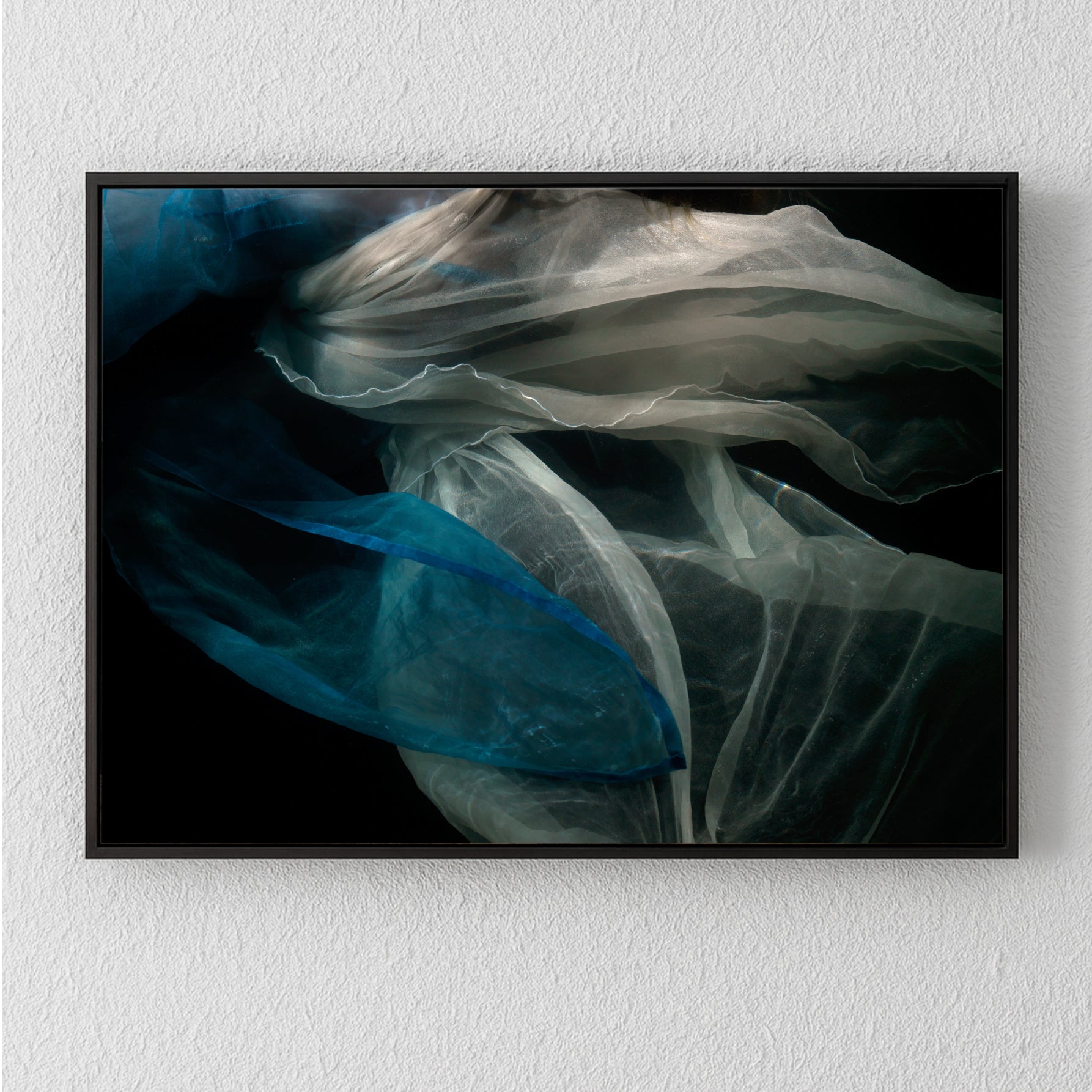 Abstract unique archival pigment print with flowing translucent shapes in blue and white on black background.