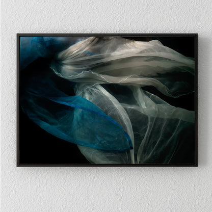 Abstract unique archival pigment print with flowing translucent shapes in blue and white on black background.