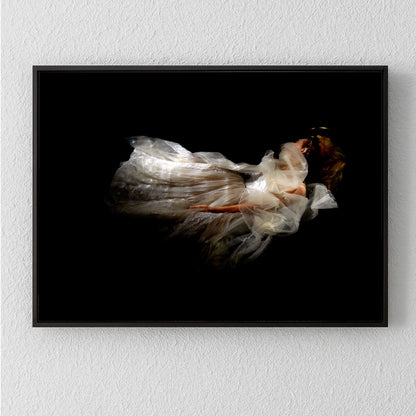 Unique archival pigment print of a softly blurred figure in flowing white dress against black background.