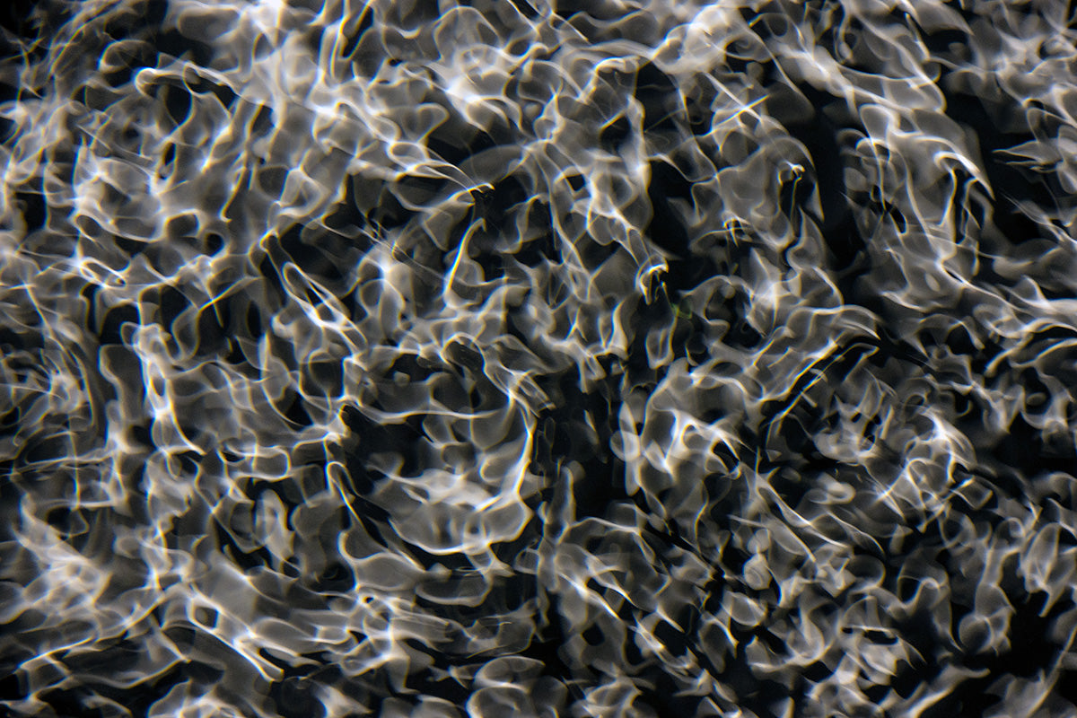 Detail of Cymatic Plate 6452 showing fluid light patterns formed through resonance in water, analogue photograph by Alexander James Hamilton