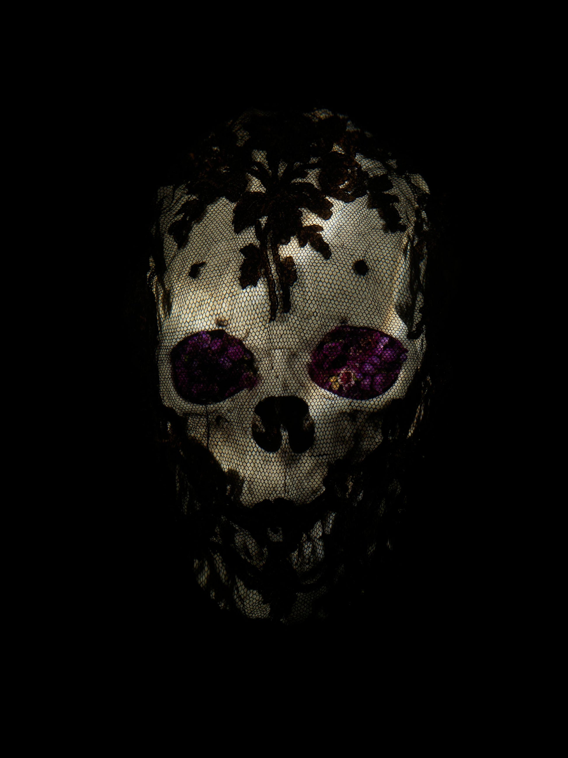 Veiled skull with flowers detail by Alexander James Hamilton, analogue photograph produced through water and light