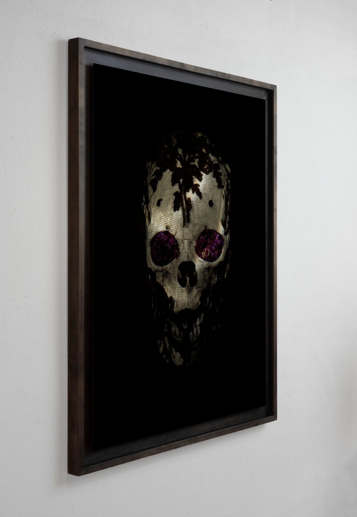 Veiled skull with flowers installation view by Alexander James Hamilton, analogue photograph produced through water and light
